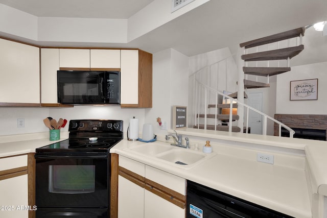 2333 E Southern Ave Unit 2016, Tempe, AZ 85282 - kitchen with black appliances, white cabinetry, light countertops, and open shelves