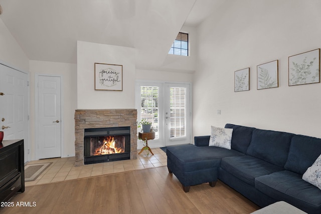 2333 E Southern Ave Unit 2016, Tempe, AZ 85282 - living area with a fireplace, healthy amount of natural light, wood finished floors, and high vaulted ceiling