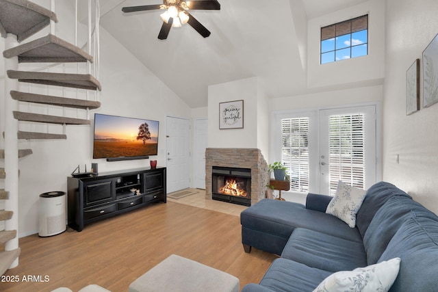 2333 E Southern Ave Unit 2016, Tempe, AZ 85282 - living room featuring high vaulted ceiling, ceiling fan, wood finished floors, healthy amount of natural light, and a fireplace