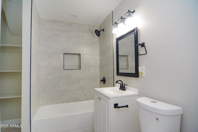 bathroom with toilet, vanity, and shower / tub combination