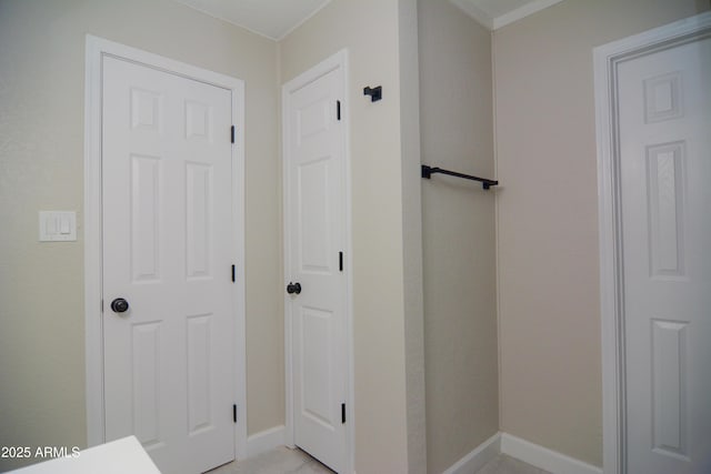 interior space featuring baseboards