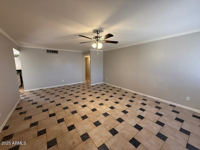 spare room featuring a ceiling fan, baseboards, and ornamental molding