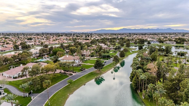 drone / aerial view with a residential view and a water and mountain view
