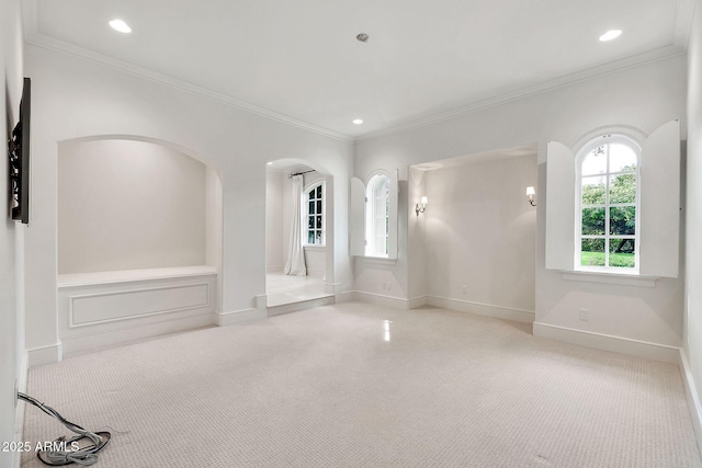 empty room featuring carpet flooring, recessed lighting, and baseboards