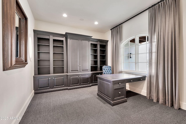 office area with recessed lighting, dark carpet, and baseboards