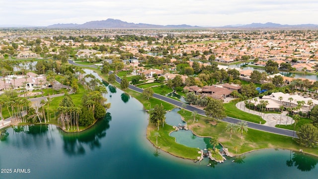birds eye view of property with a residential view and a water and mountain view