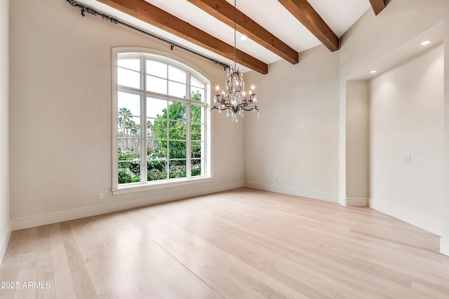 empty room with an inviting chandelier, beamed ceiling, light wood-style floors, and baseboards