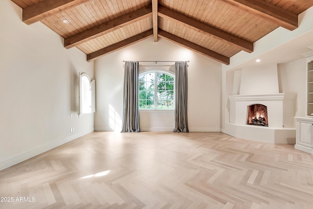 unfurnished living room with recessed lighting, baseboards, a lit fireplace, and beam ceiling