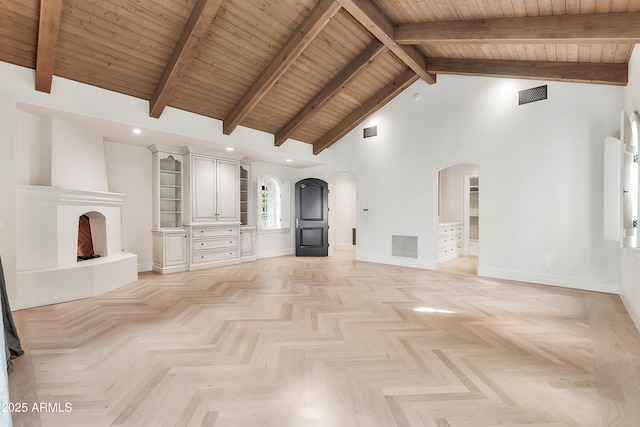 unfurnished living room with arched walkways, visible vents, high vaulted ceiling, and baseboards