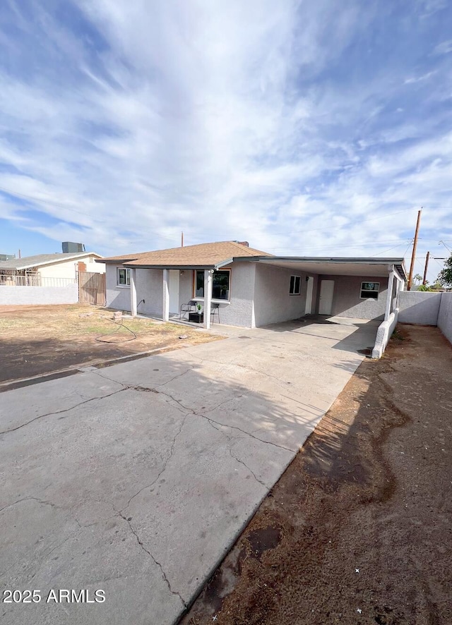 view of front of home featuring a carport