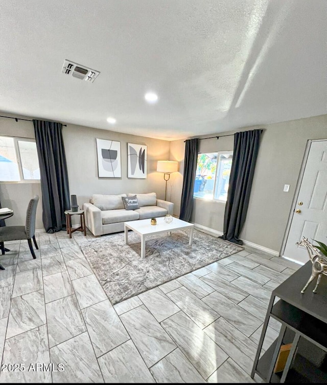 living room featuring a textured ceiling