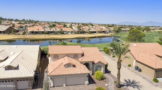 aerial view featuring a water and mountain view