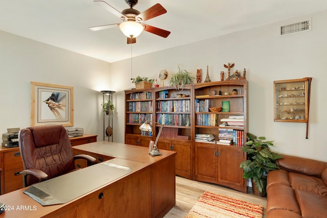 office featuring light hardwood / wood-style flooring and ceiling fan