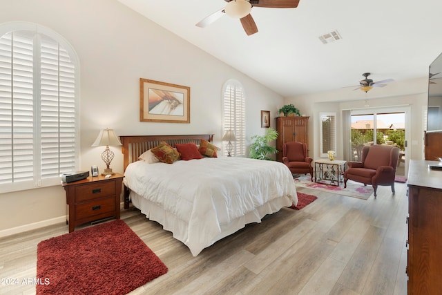 bedroom featuring lofted ceiling, light hardwood / wood-style floors, and ceiling fan