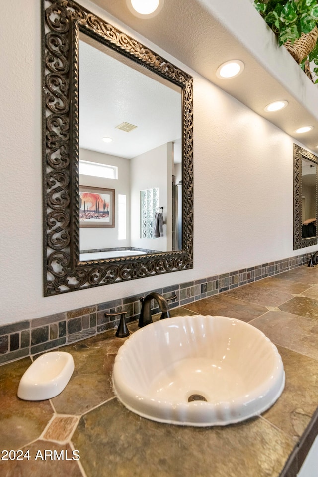 bathroom with sink and a textured ceiling