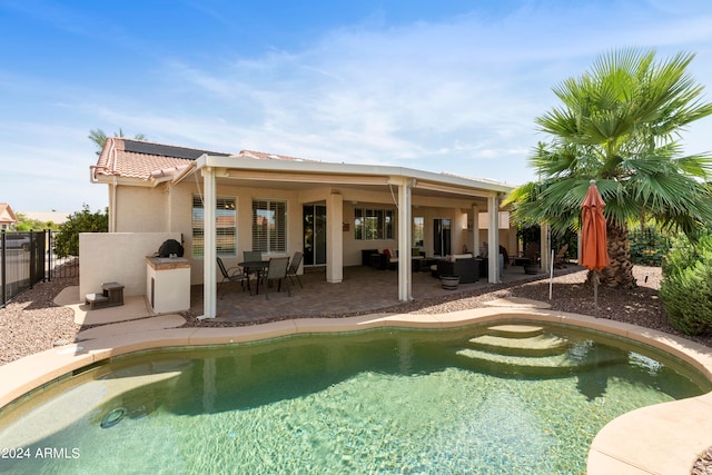 exterior space featuring a patio and a fenced in pool