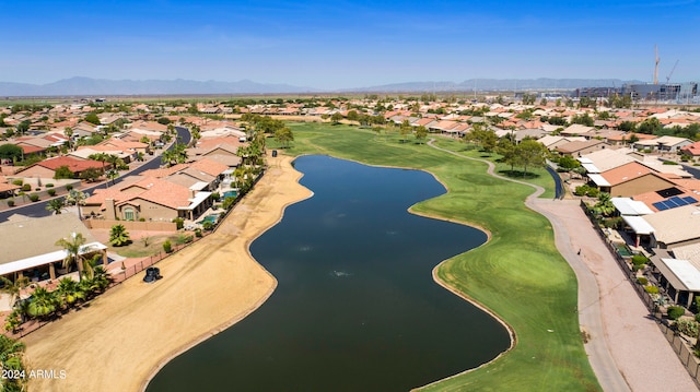 birds eye view of property with a water and mountain view