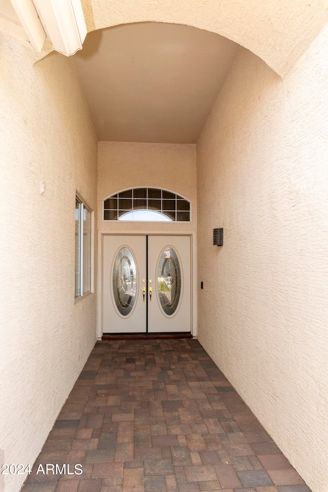 entrance to property with washer and clothes dryer and french doors