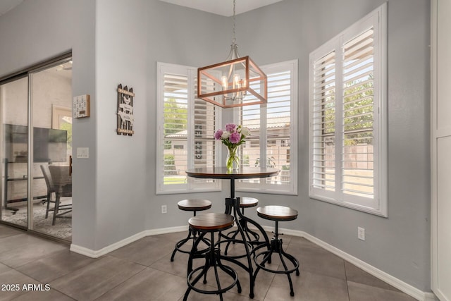 1884 E Stephens Dr, Tempe, AZ 85283 - tiled dining space featuring a chandelier and baseboards