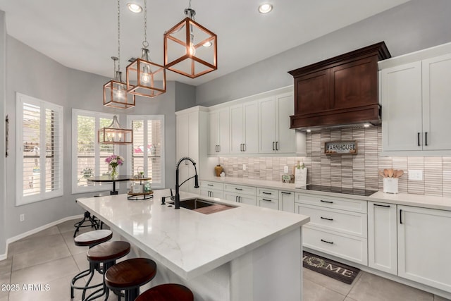 1884 E Stephens Dr, Tempe, AZ 85283 - kitchen featuring a sink, black electric stovetop, a chandelier, light tile patterned flooring, and recessed lighting