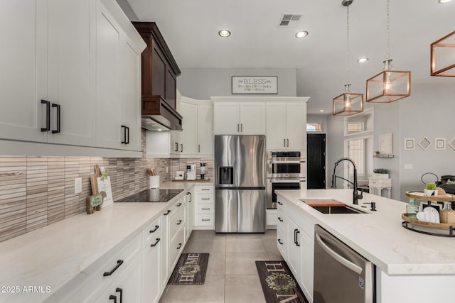 1884 E Stephens Dr, Tempe, AZ 85283 - kitchen featuring stainless steel appliances, a sink, tasteful backsplash, light tile patterned floors, and recessed lighting