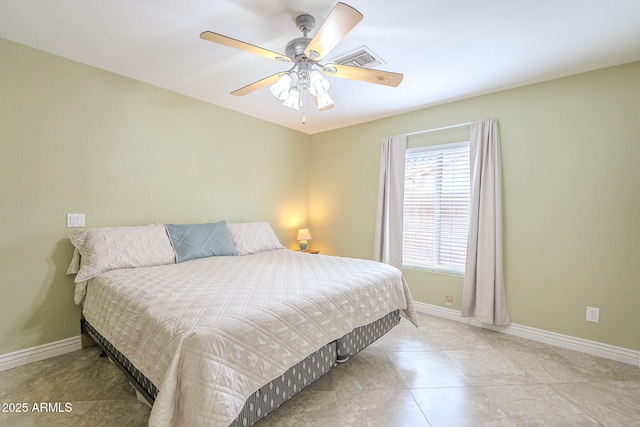 tiled bedroom featuring baseboards, visible vents, and ceiling fan