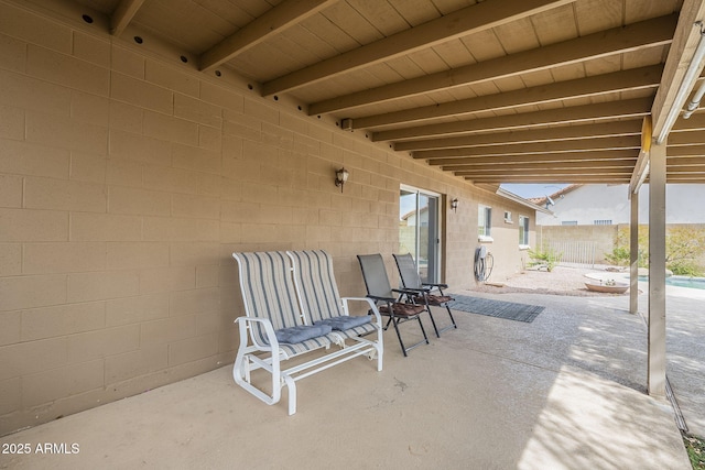 view of patio featuring fence