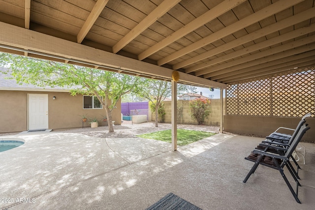 view of patio featuring fence