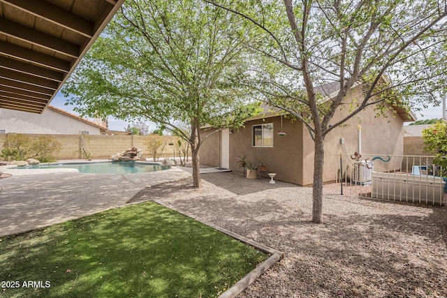 view of yard featuring a fenced in pool, a patio area, and a fenced backyard