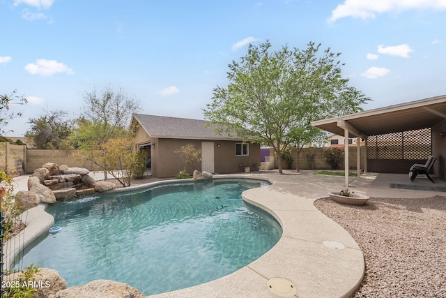 view of swimming pool featuring a patio area, a fenced backyard, a fenced in pool, and an outdoor structure