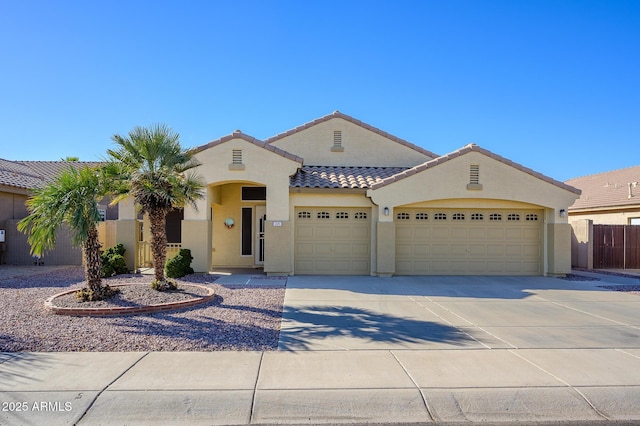 mediterranean / spanish-style house featuring a garage