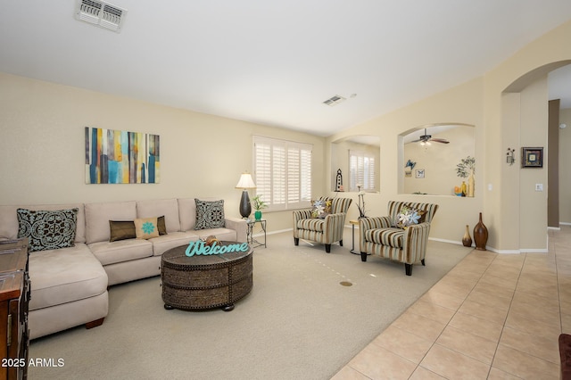 living room with ceiling fan and light tile patterned floors