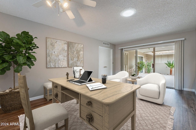 office area with ceiling fan, wood-type flooring, and a textured ceiling