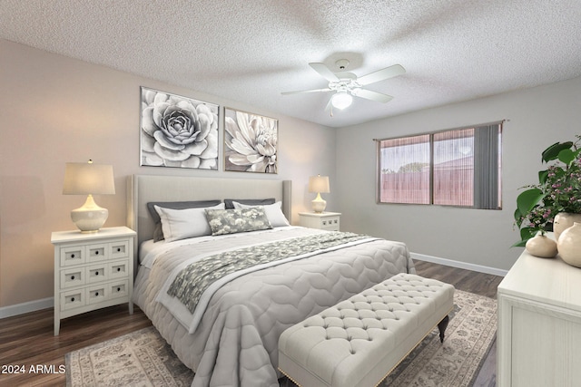 bedroom with ceiling fan, dark hardwood / wood-style flooring, and a textured ceiling