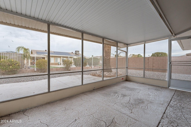 unfurnished sunroom featuring plenty of natural light