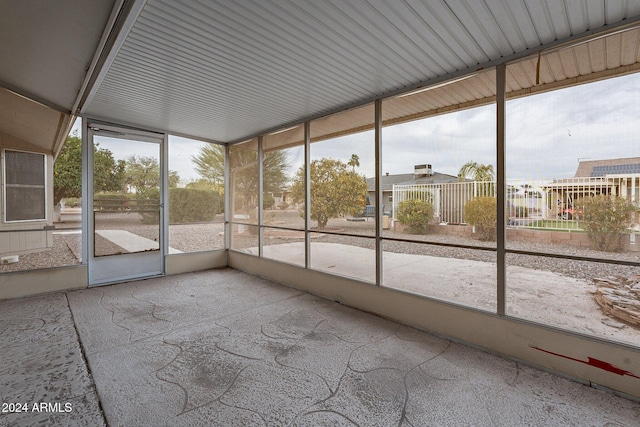 unfurnished sunroom featuring plenty of natural light