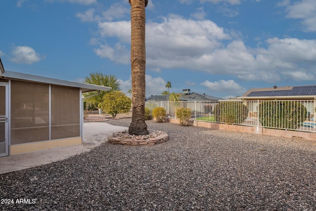 view of yard with a sunroom