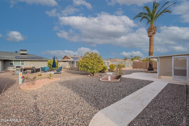 view of yard with a patio and central AC unit