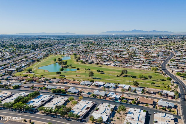 aerial view featuring a water and mountain view