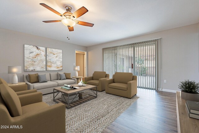 living room with ceiling fan and wood-type flooring