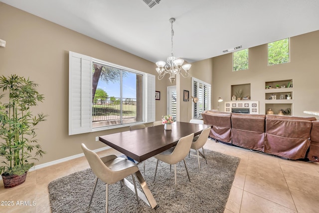 3131 E Legacy Dr Unit 1032, Phoenix, AZ 85042 - dining space with healthy amount of natural light, light tile patterned flooring, and a chandelier
