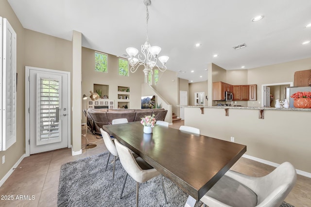 3131 E Legacy Dr Unit 1032, Phoenix, AZ 85042 - dining space with a chandelier, baseboards, stairway, recessed lighting, and light tile patterned floors