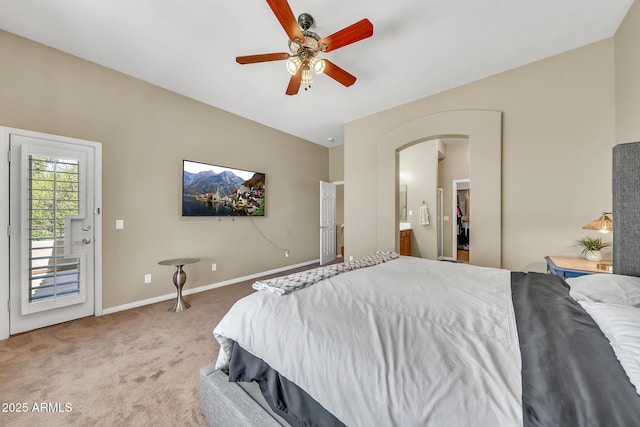 3131 E Legacy Dr Unit 1032, Phoenix, AZ 85042 - carpeted bedroom featuring arched walkways, baseboards, ensuite bathroom, a ceiling fan, and access to exterior