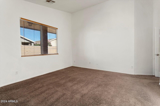 unfurnished room with carpet flooring