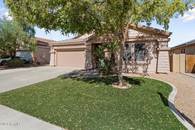 view of front of house featuring a front lawn and a garage