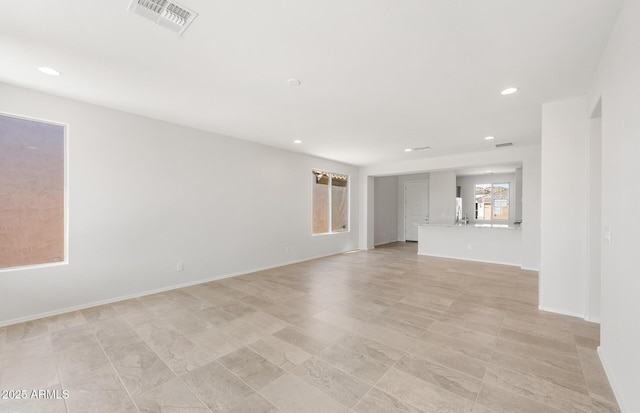 21292 N 270th Dr, Buckeye, AZ 85396 - unfurnished living room featuring recessed lighting and baseboards