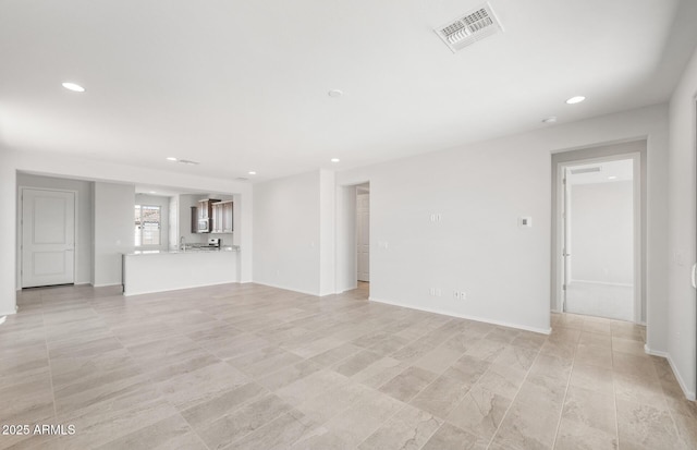 21292 N 270th Dr, Buckeye, AZ 85396 - unfurnished living room featuring recessed lighting, baseboards, and light tile patterned floors