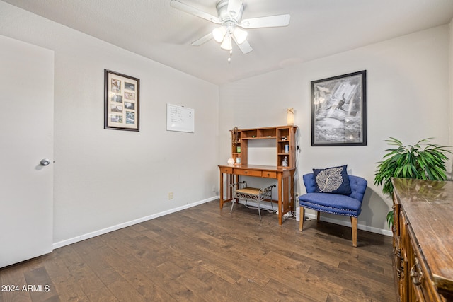 sitting room featuring dark hardwood / wood-style flooring and ceiling fan