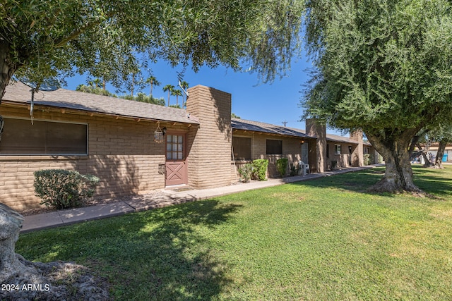 exterior space with a yard