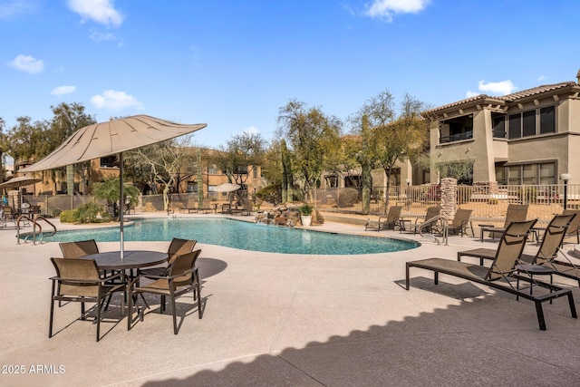 view of swimming pool with a patio area